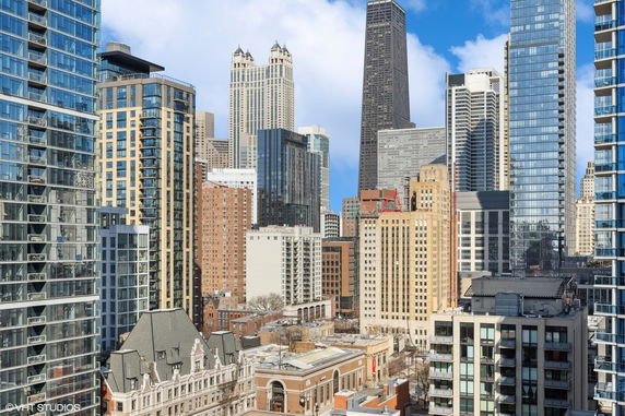 Skyline view of multiple high-rise buildings in a city.