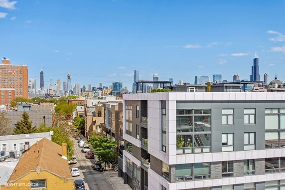 Panoramic view of a city skyline with buildings and clear sky.