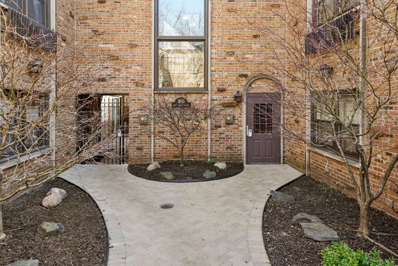 Front view of a brick building with a central entrance.
