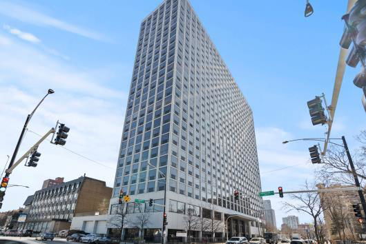 Front view of a tall, multi-story office building.