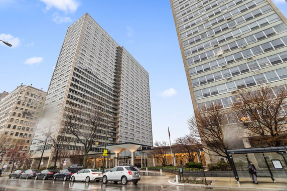 Front view of a high-rise residential building with multiple stories.