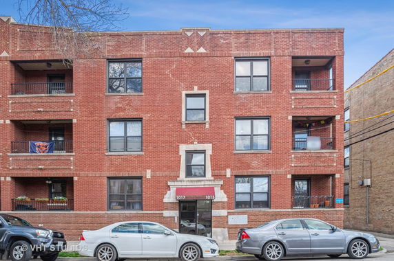 Front view of a multi-story brick residential building.