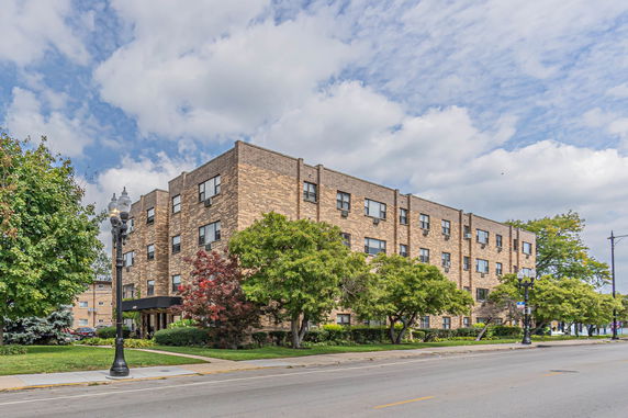 Front view of a multi-story brick building.