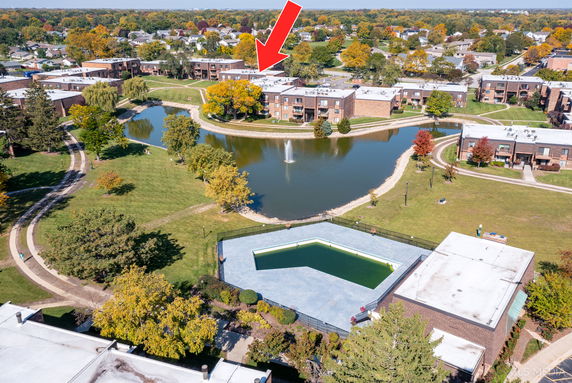 Panoramic view of a residential area with ponds and gardens.