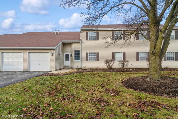 Front view of a two-story house with an attached double garage.