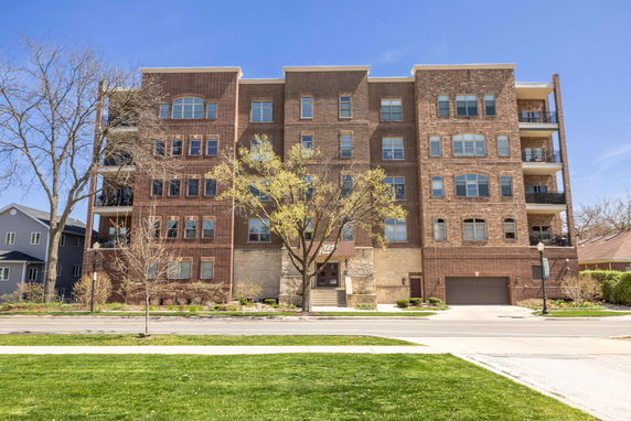 Front view of a multi-story brick apartment building