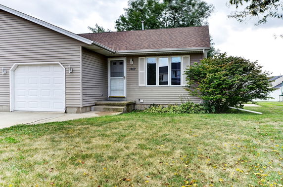 Front view of a single-story house with an attached garage.