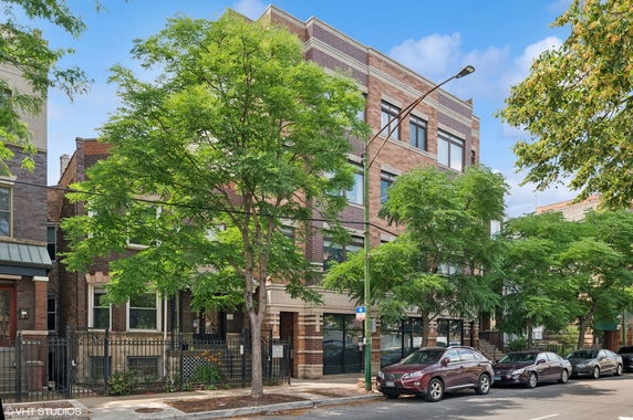 Front view of a multi-story brick building.