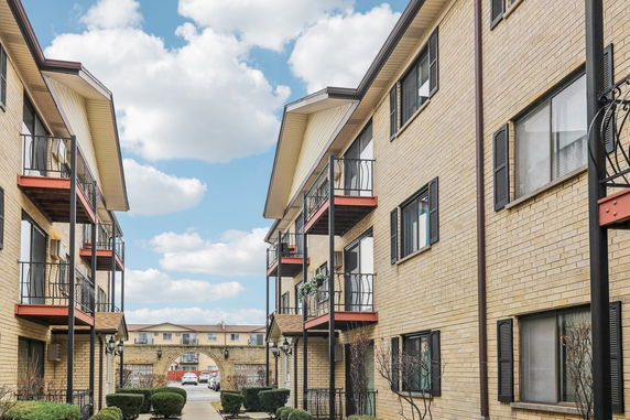 View of multi-story apartment buildings with balconies.