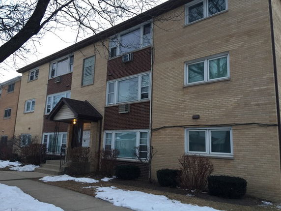 Front view of a multi-story apartment building.