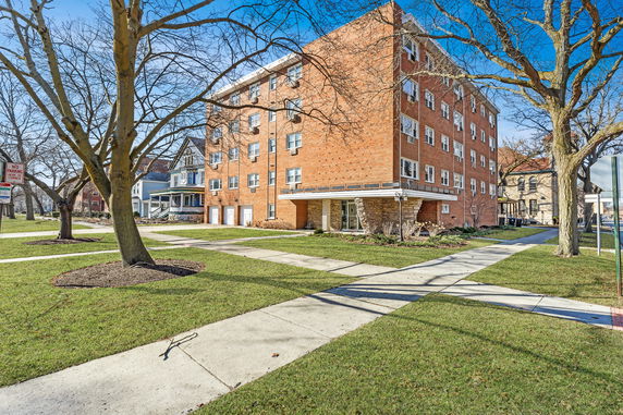 Front view of a multi-story brick apartment building