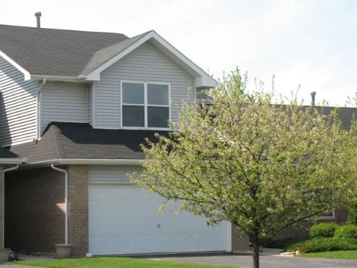 Front view of a two-story house with a double garage.