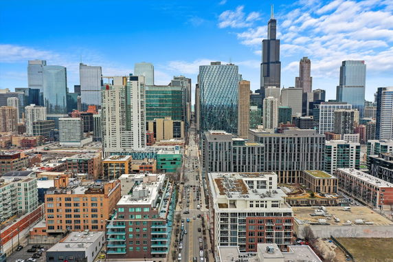 Panoramic view of a cityscape with various skyscrapers and buildings.