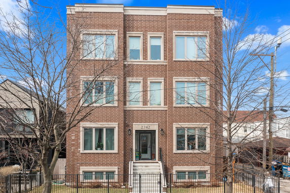 Front view of a four-story brick building.
