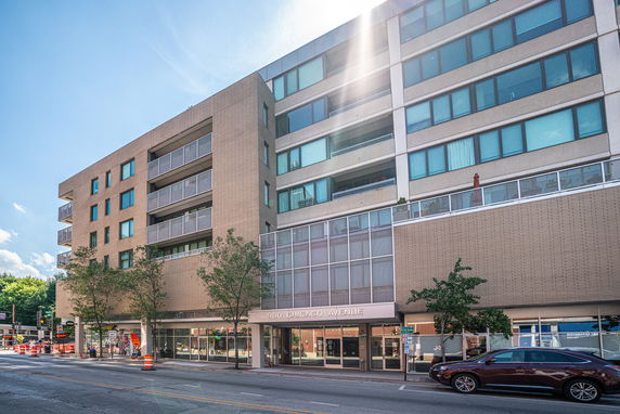 Front view of a multi-story commercial building with a modern facade.