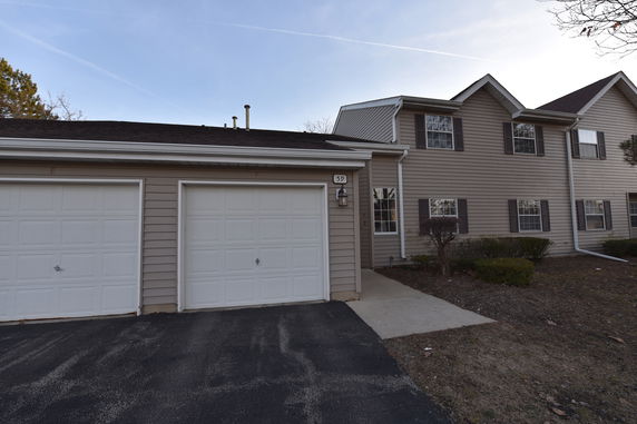 Front view of a two-story house with a double garage.