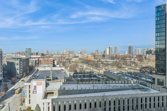 Aerial view of a cityscape with buildings and streets.