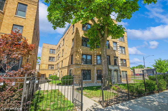 Front view of a multi-story brick residential building.
