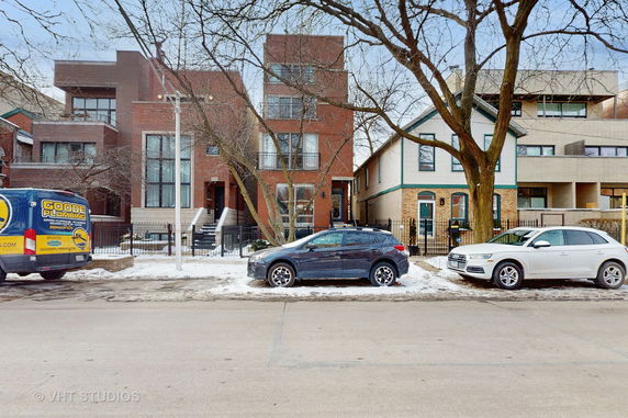 Front view of modern multi-story residential buildings.