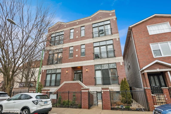 Front view of a multi-story brick residential building.