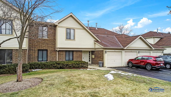 Front view of a two-story house with a double garage.
