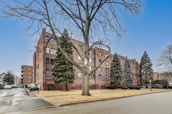 Front view of a multi-story brick apartment building