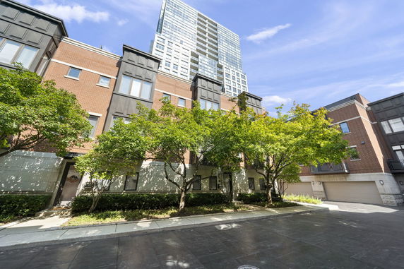 Front view of a multi-story residential building with a modern design.