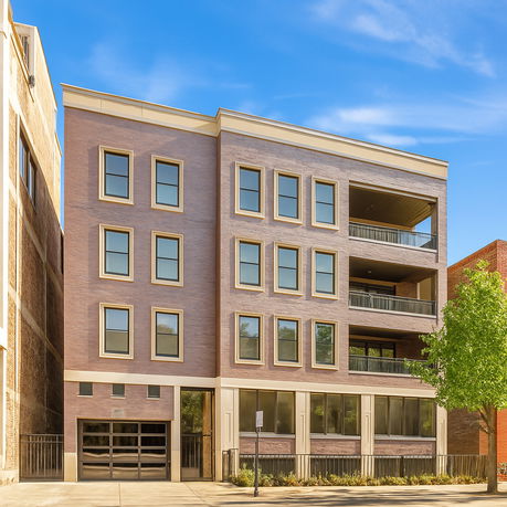 Front view of a multi-story apartment building with balconies.