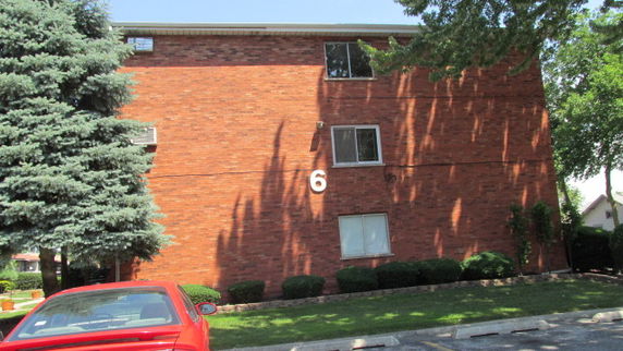 Front view of a three-story brick building.