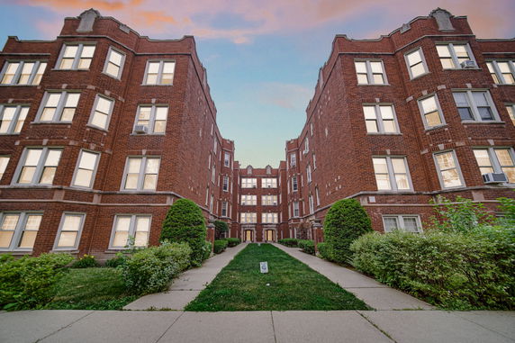 Front view of a brick apartment building.
