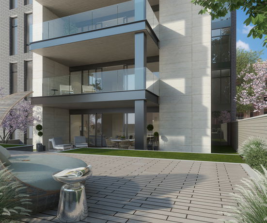 Front view of a modern multi-story building with glass balconies.