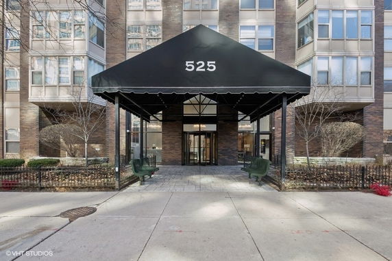 Front view of a multi-story building with an entrance canopy marked 525.