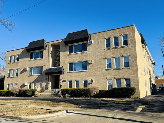 Front view of a three-story apartment building.