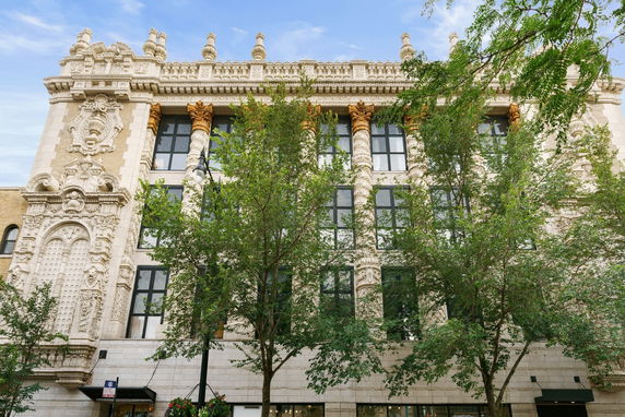Front view of an ornate historical building with detailed architectural features.