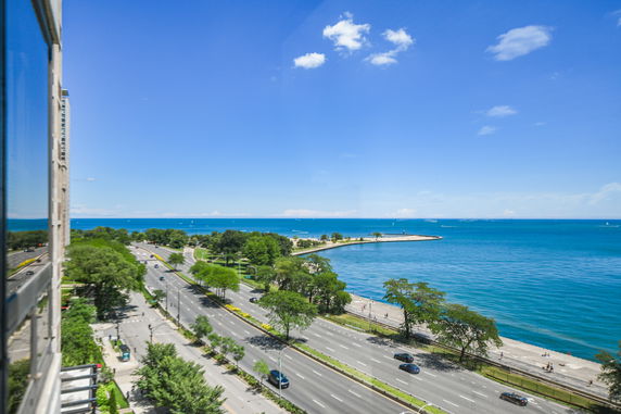 Panoramic view of a coastline road and expansive ocean.