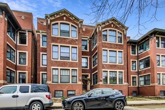 Front view of a multi-story brick apartment building