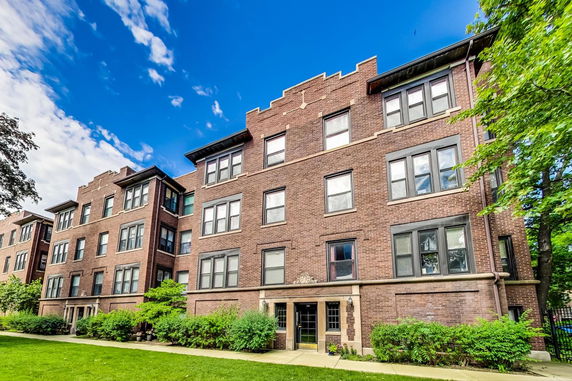 Front view of a multi-story brick apartment building