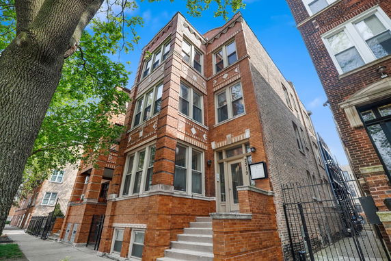 Front view of a multi-story brick building.
