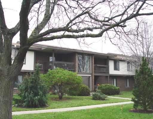 Front view of a two-story residential building with balconies.