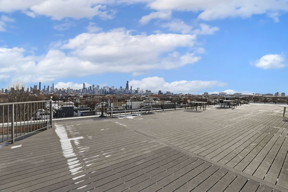 Rooftop with city skyline view in the background