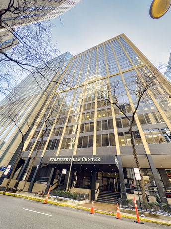 Front view of a multi-story office building with a modern facade.