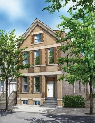 Front view of a three-story house with a gabled roof and brick exterior.