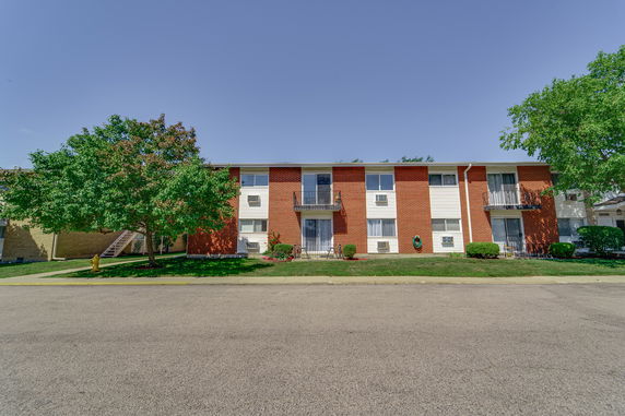 Front view of a two-story brick apartment building