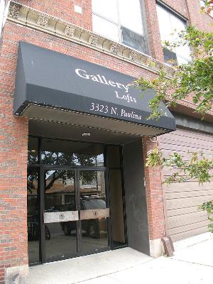 Front view of a building with an awning labeled 'Gallery Lofts.'