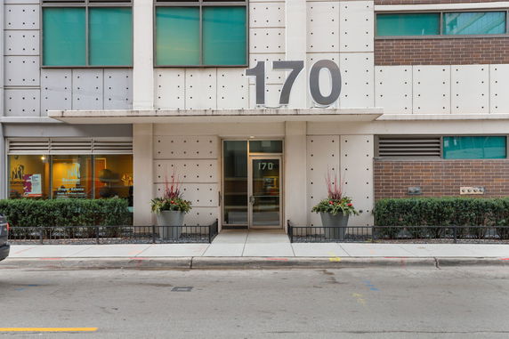 Front view of a building with large numbers '170' and glass entrance doors.