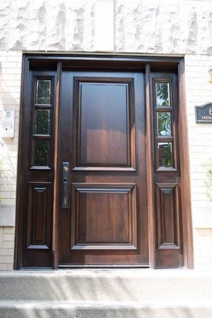 Front view of a house with a decorative wooden door.
