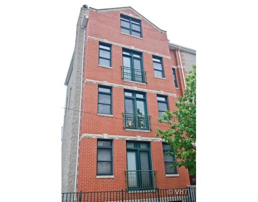 Front view of a four-story brick building.