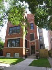 Front view of a multi-story brick building.