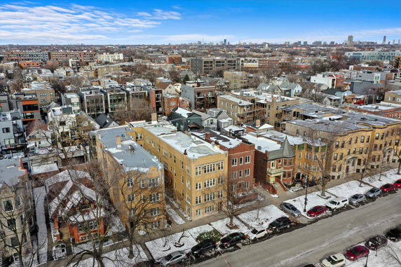 Panoramic view of a residential neighborhood with various buildings and houses.
