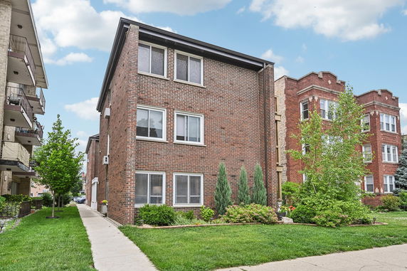 Front view of a multi-story brick building.